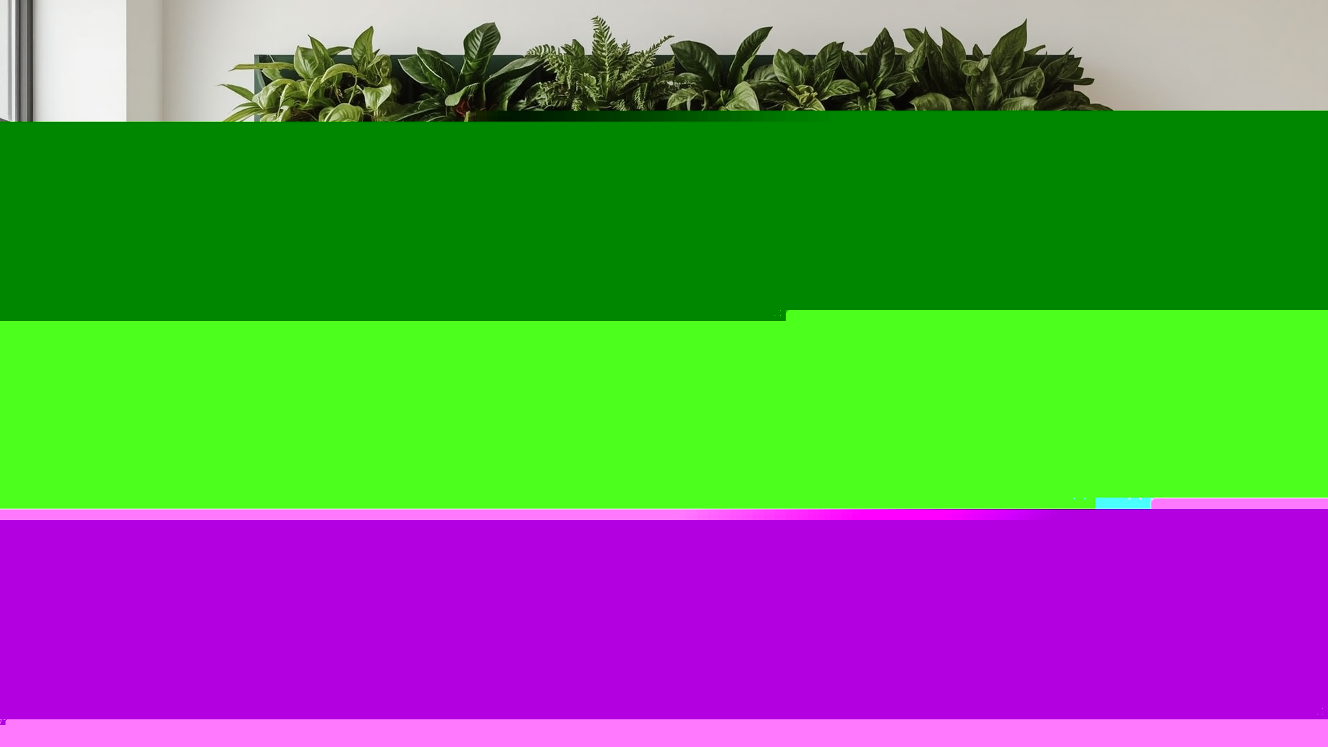 Lush indoor living plant wall featuring pothos, ferns, and peperomia in fabric pockets